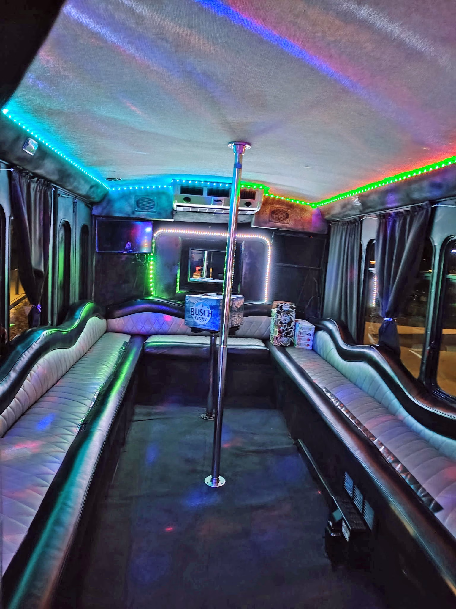 Inside the KC Metro Party Bus — LED lights, seating, and dance pole